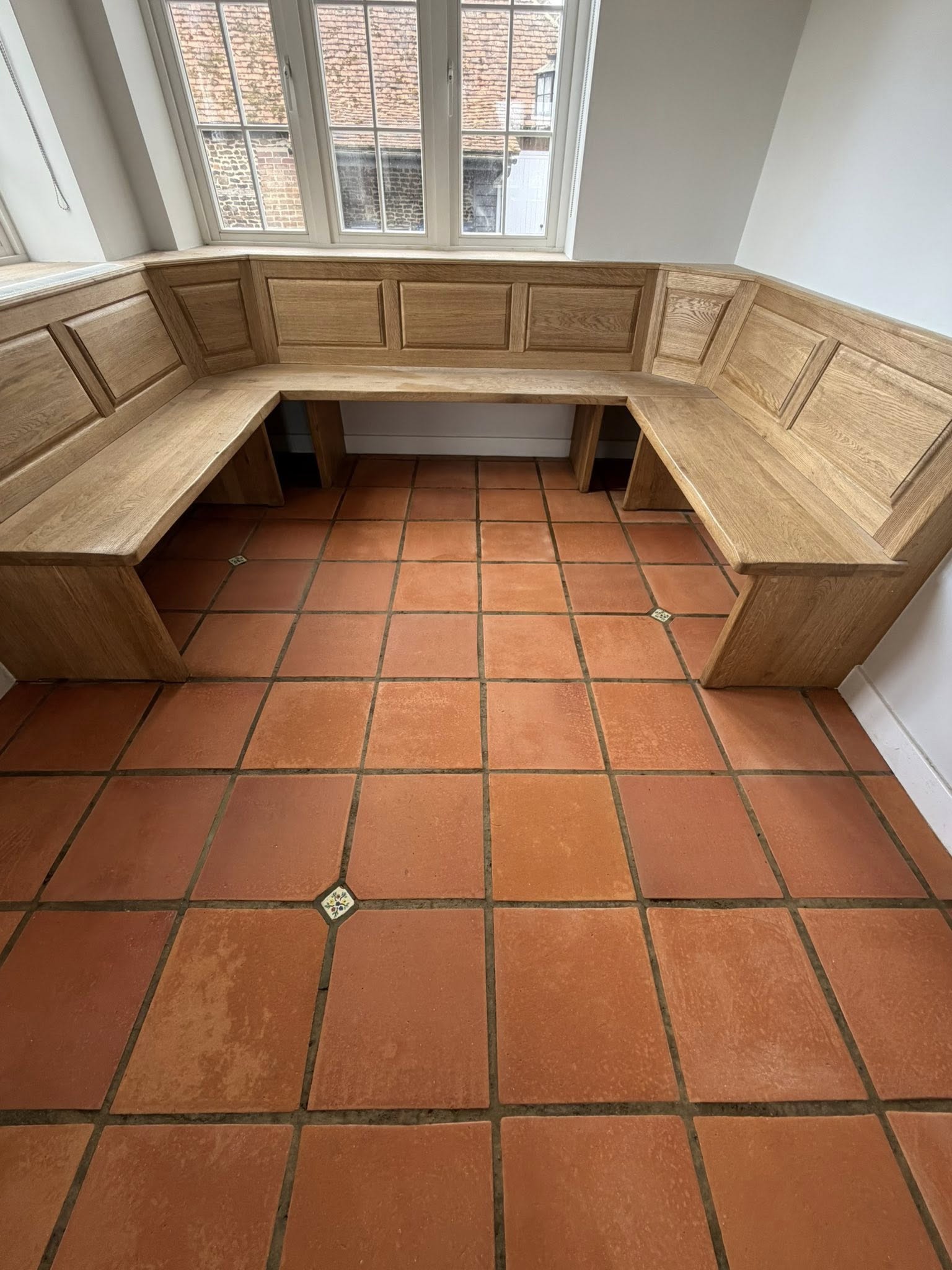 Polished marble bathroom floor after deep clean and refinishing by Floorless Restoration