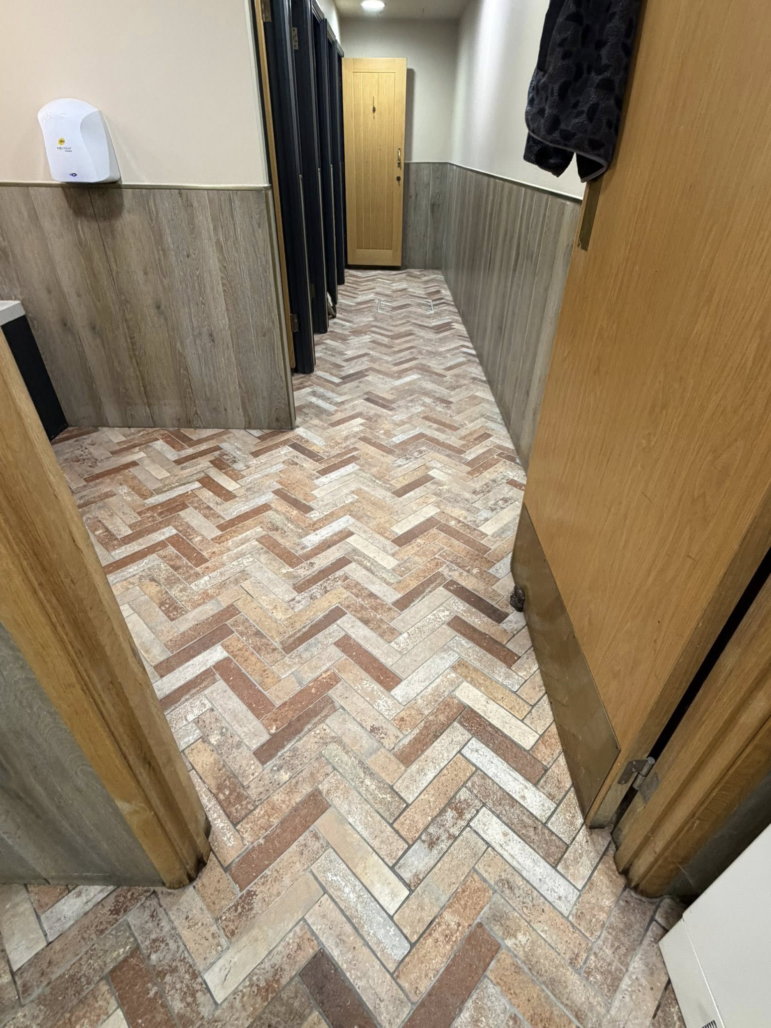 Herringbone brick floor deep cleaned and restored by Floorless Restoration
